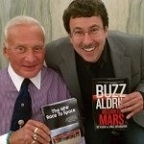 Eric Knight and Buzz Aldrin exchange signed copies of their aerospace books